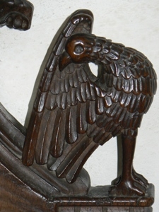 Arm rest carving. Bird preening. Eagle? 