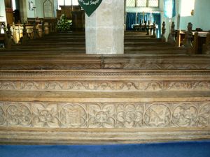 Part of the carving on the rear Dedication bench.