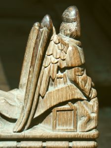 Figure of an angel with scroll may be the emblem of St. Matthew.