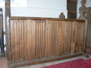 mediaeval bench with later linenfold panelling.