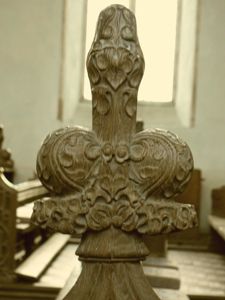 Close-up of one of the poppyheads crowning the bench-ends.